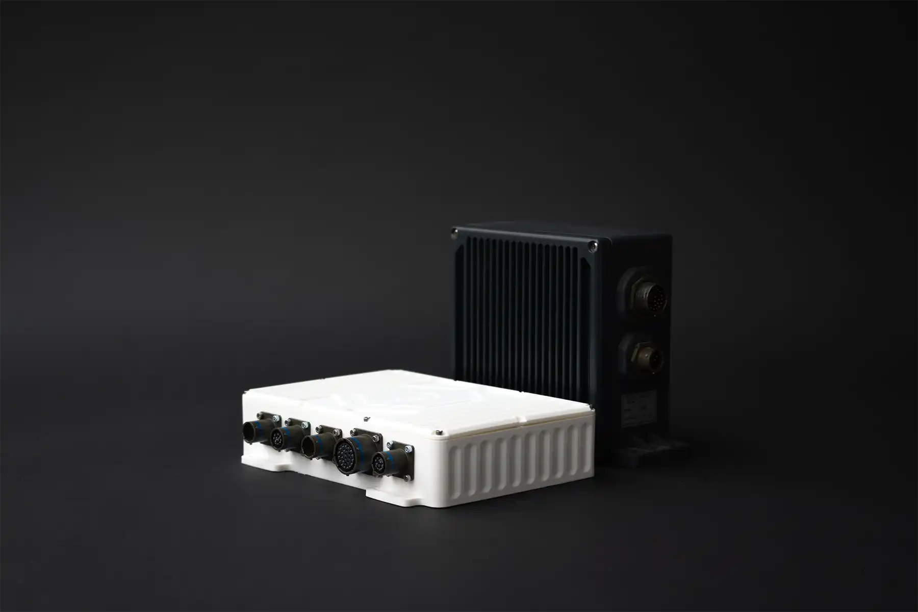 Comparison of two predictive diagnostics units – modern white and legacy dark gray models