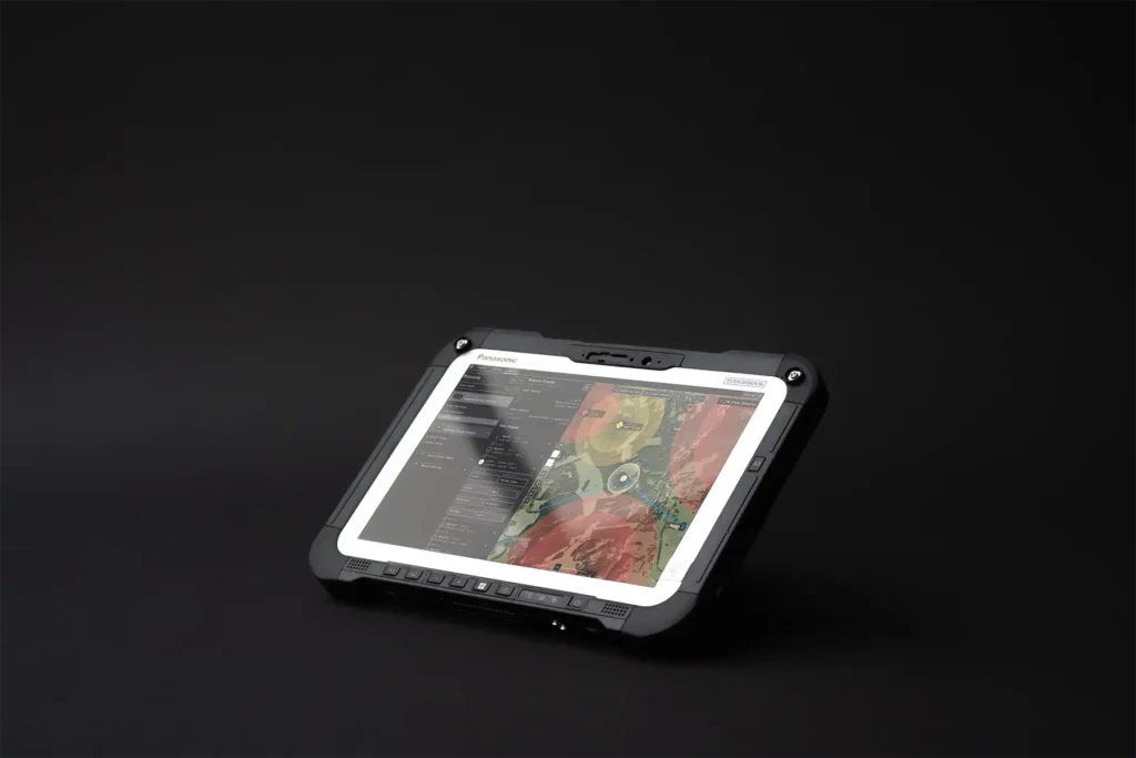 Angled view of rugged tablet showing UAV Mission Planner software in operation