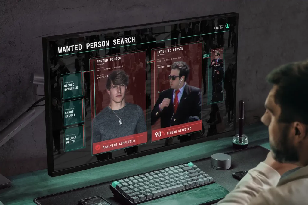 Video analytics interface detecting a wanted person using facial recognition on a crowded surveillance feed