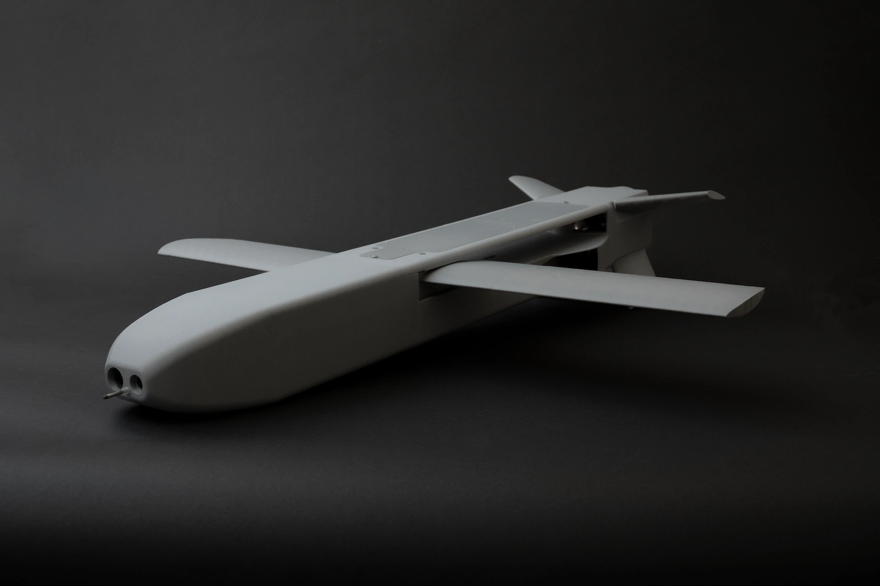 three-quarter view of the JWI-4000 interceptor UAV with fixed wings and front sensor suite