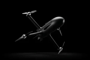 Angled underside view of the modular Interceptor counter-drone quadcopter highlighting its aerodynamic cylindrical body and four rotors.