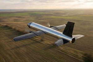 Rear perspective of the JWI-4000 unmanned aerial interceptor flying away over open terrain.